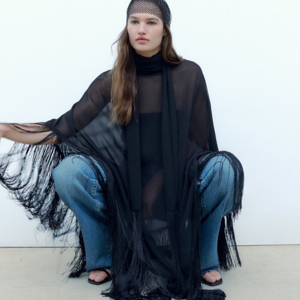 ZARA MESH FRINGED GAUZE CAPE
High collar cape with multi-positional tie detail.